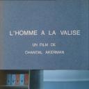 提行李箱的人.海报